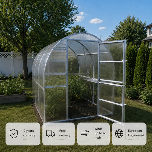 The Compact polycarbonate tunnel greenhouse by PrimeGreenhouses in a small backyard
