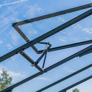 Automatic roof window opener for a glass greenhouse