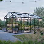 The Cottage classic glass greenhouse with gable roof in backyard garden