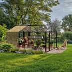 Interior of The Cottage glass greenhouse with couch and plants